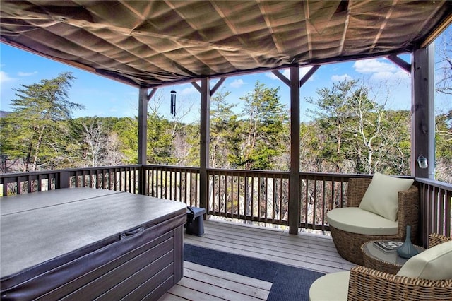 deck featuring a hot tub