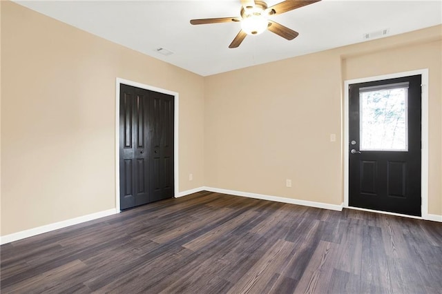 entryway with dark wood-type flooring and ceiling fan