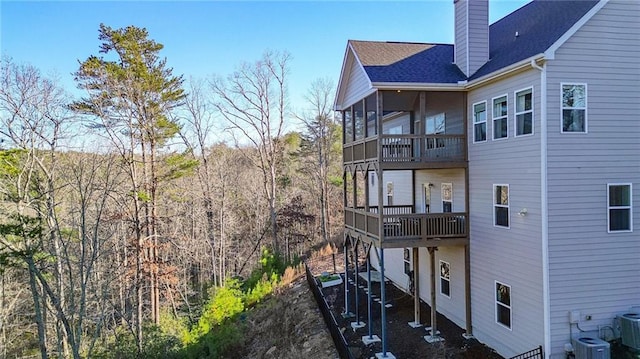 back of property featuring a sunroom