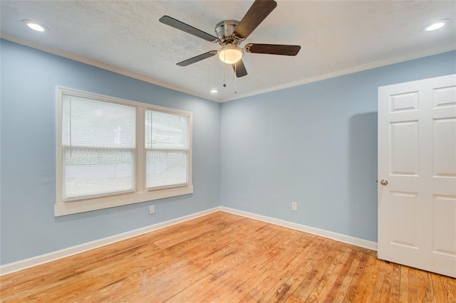 unfurnished room featuring crown molding, ceiling fan, and light hardwood / wood-style floors