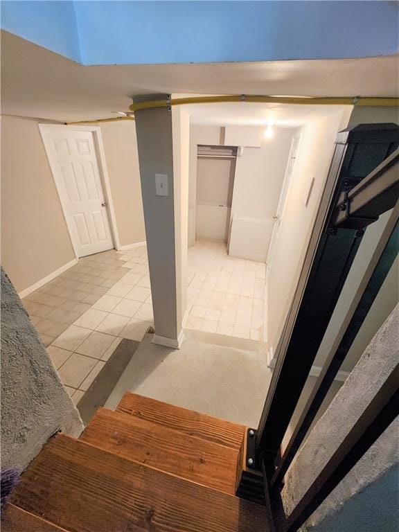 stairs featuring tile patterned floors