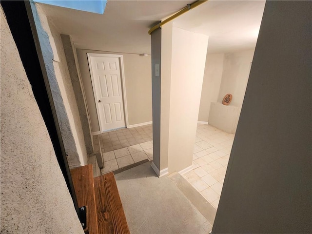 hall featuring light tile patterned flooring