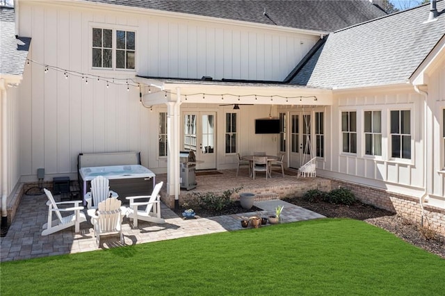 124 Long Shadows Dr, Alpharetta, GA 30004 - rear view of property featuring a hot tub, a shingled roof, a patio area, a yard, and french doors