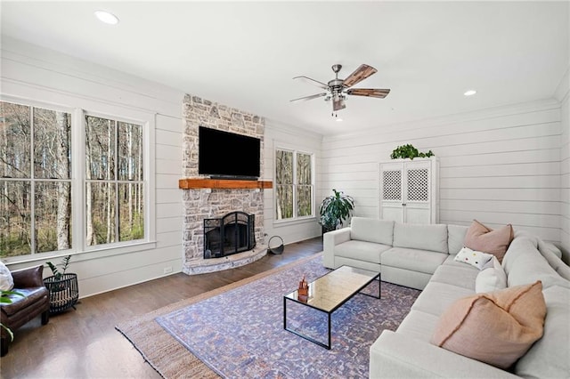 124 Long Shadows Dr, Alpharetta, GA 30004 - living area with a ceiling fan, wood finished floors, a stone fireplace, wood walls, and recessed lighting