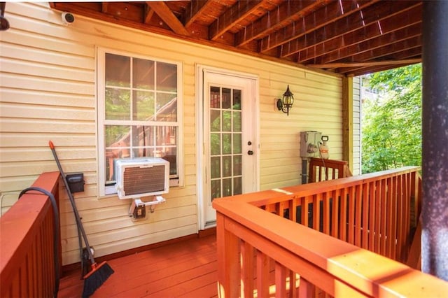 wooden deck featuring cooling unit
