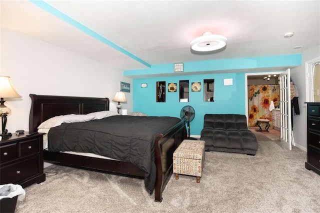 carpeted bedroom featuring baseboards