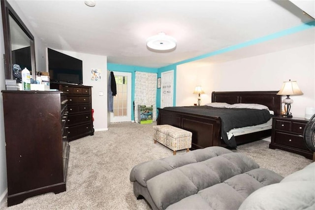 bedroom featuring carpet floors and baseboards