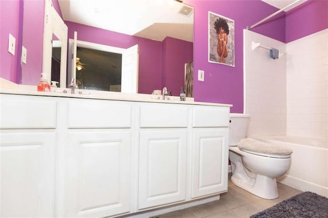 full bath with tile patterned flooring, toilet, double vanity, and shower / bathtub combination