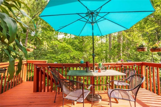 wooden deck featuring outdoor dining space