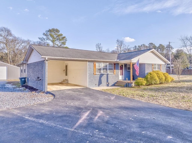 single story home featuring a carport