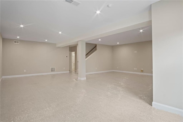 finished below grade area with recessed lighting, baseboards, and visible vents