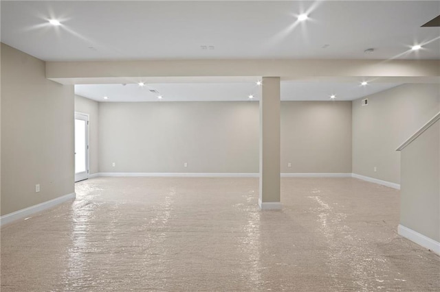 basement featuring recessed lighting and baseboards