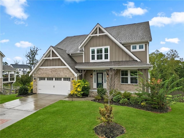 craftsman inspired home featuring board and batten siding, concrete driveway, a front yard, a shingled roof, and brick siding