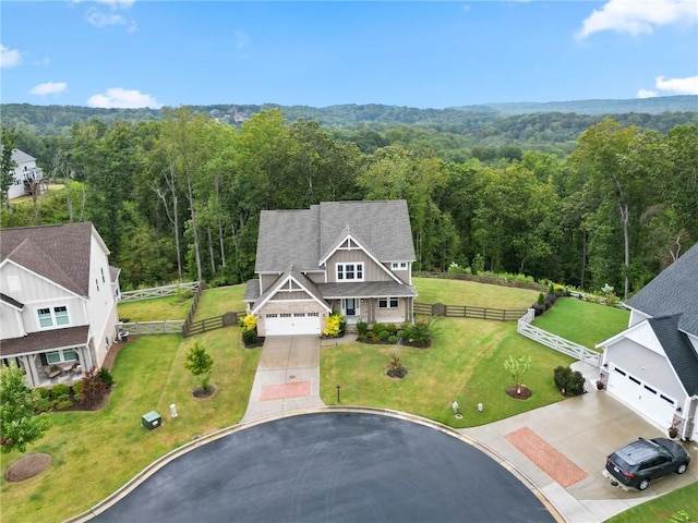 bird's eye view featuring a forest view