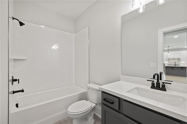 bathroom with toilet, vanity, and shower / bath combination