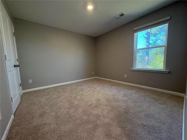 interior space with baseboards and visible vents