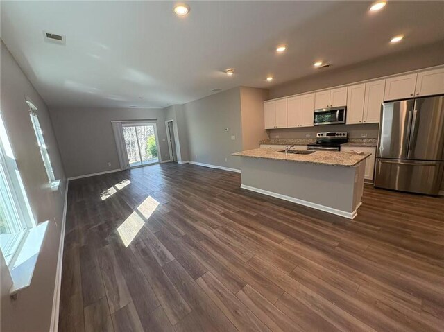 kitchen featuring visible vents, dark wood finished floors, appliances with stainless steel finishes, white cabinetry, and recessed lighting