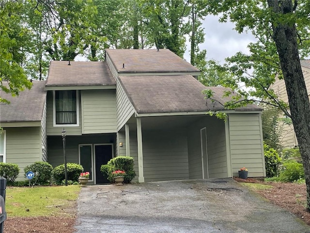 104 Woodhaven Way, Alpharetta, GA 30009 - view of front facade with driveway, an attached carport, and roof with shingles