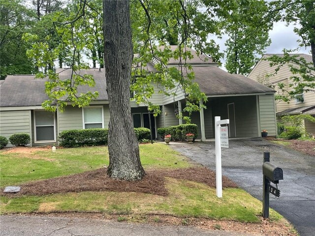 104 Woodhaven Way, Alpharetta, GA 30009 - view of front facade featuring asphalt driveway, a shingled roof, a front lawn, and a carport