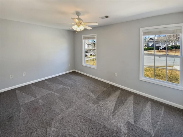 93 Wolfridge Ct, Dallas, GA 30132 - empty room with visible vents, baseboards, plenty of natural light, and dark carpet