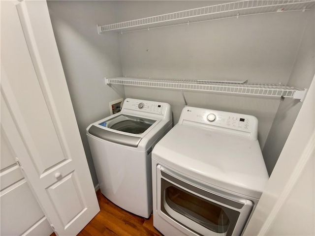 93 Wolfridge Ct, Dallas, GA 30132 - laundry area with washer and clothes dryer, laundry area, and dark wood-type flooring