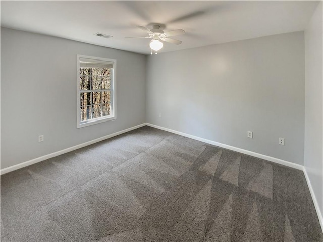 93 Wolfridge Ct, Dallas, GA 30132 - unfurnished room with visible vents, dark carpet, baseboards, and a ceiling fan