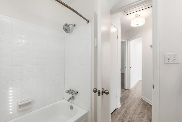 full bath featuring shower / bath combination and wood finished floors