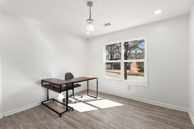 office space with baseboards, visible vents, wood finished floors, and recessed lighting