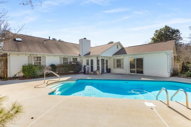 view of swimming pool with fence, a fenced in pool, and a patio