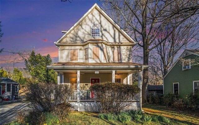 victorian home with a porch and a ceiling fan