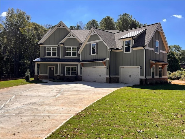 view of front of house with a front yard and a garage