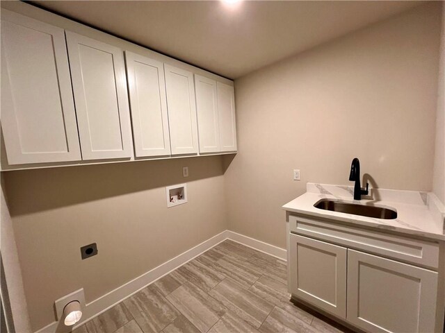 laundry room with cabinets, hookup for an electric dryer, sink, and washer hookup