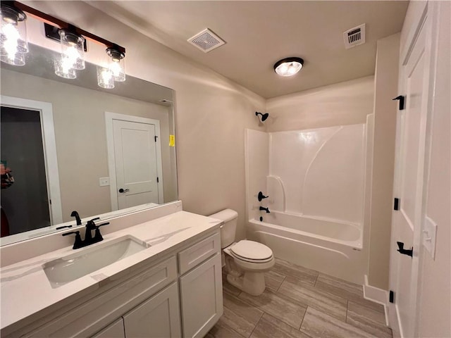 full bathroom with toilet, vanity, and shower / bath combination