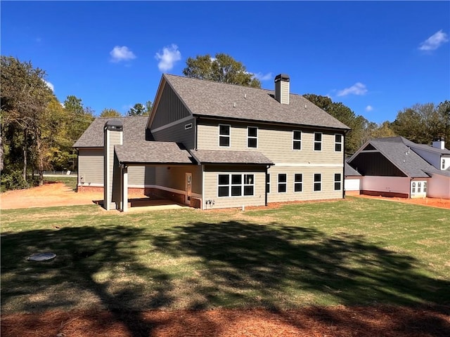 back of property featuring a patio area and a lawn