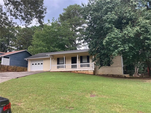 single story home featuring covered porch, a garage, fence, driveway, and a front lawn