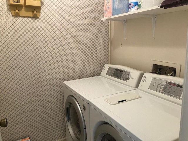 washroom featuring laundry area and washer and clothes dryer