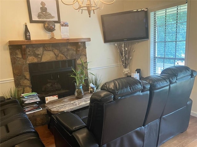 living room featuring a fireplace and wood finished floors