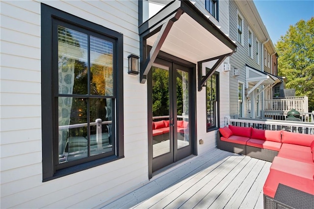 wooden deck featuring an outdoor hangout area