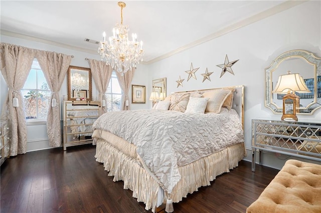 bedroom with ornamental molding, dark hardwood / wood-style floors, and a chandelier