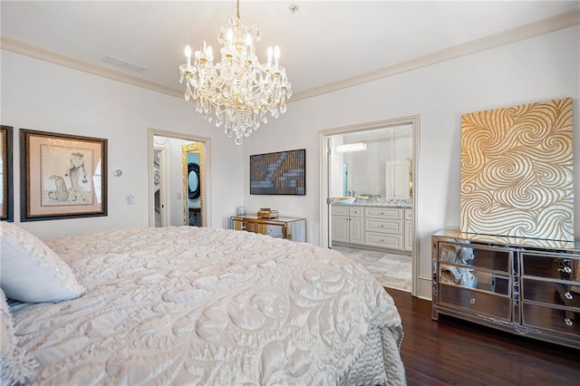 bedroom featuring connected bathroom, a walk in closet, ornamental molding, dark hardwood / wood-style flooring, and a notable chandelier