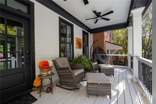 wooden deck featuring ceiling fan