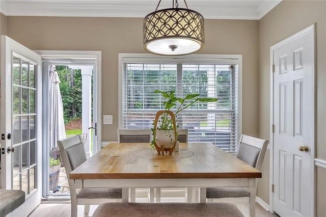 225 Ruby Forest Pkwy, Suwanee, GA 30024 - dining area with crown molding and baseboards