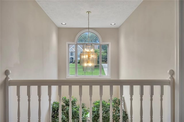 225 Ruby Forest Pkwy, Suwanee, GA 30024 - detailed view of a chandelier, a textured ceiling, and recessed lighting