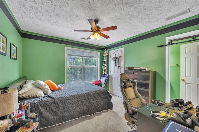225 Ruby Forest Pkwy, Suwanee, GA 30024 - bedroom featuring a textured ceiling, carpet, and a ceiling fan