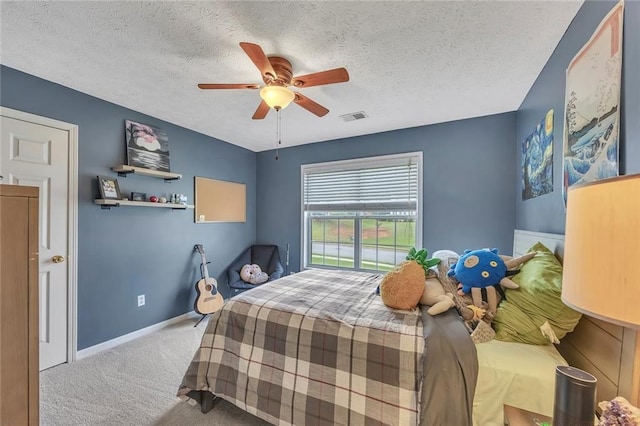 225 Ruby Forest Pkwy, Suwanee, GA 30024 - bedroom featuring carpet floors, a textured ceiling, and ceiling fan