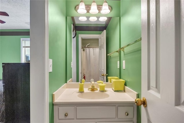225 Ruby Forest Pkwy, Suwanee, GA 30024 - bathroom featuring vanity, a textured ceiling, and ceiling fan