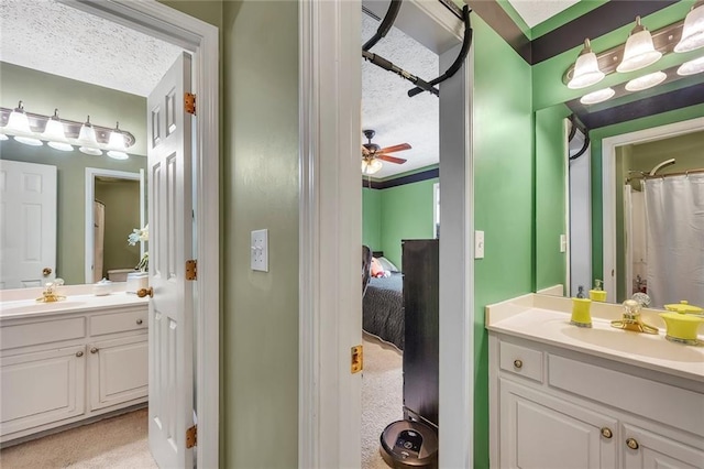 225 Ruby Forest Pkwy, Suwanee, GA 30024 - full bathroom featuring a textured ceiling, vanity, and ceiling fan
