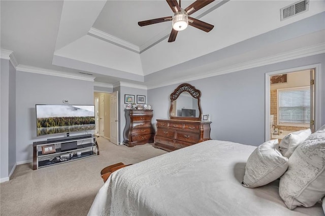 225 Ruby Forest Pkwy, Suwanee, GA 30024 - carpeted bedroom featuring a tray ceiling, ensuite bathroom, ornamental molding, and a ceiling fan