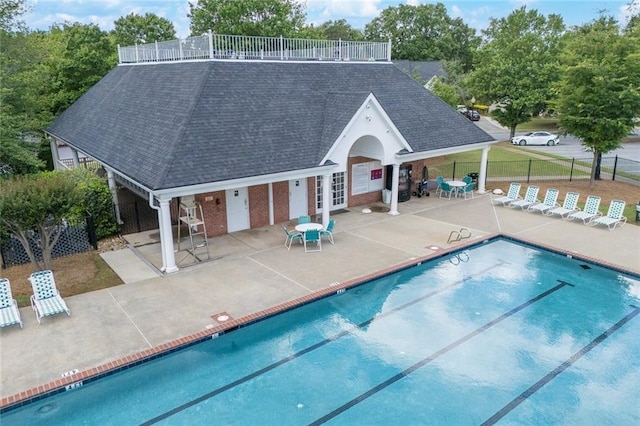 225 Ruby Forest Pkwy, Suwanee, GA 30024 - community pool featuring french doors and a patio