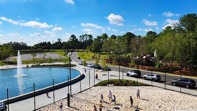 225 Ruby Forest Pkwy, Suwanee, GA 30024 - view of swimming pool with view of wooded area and a water view